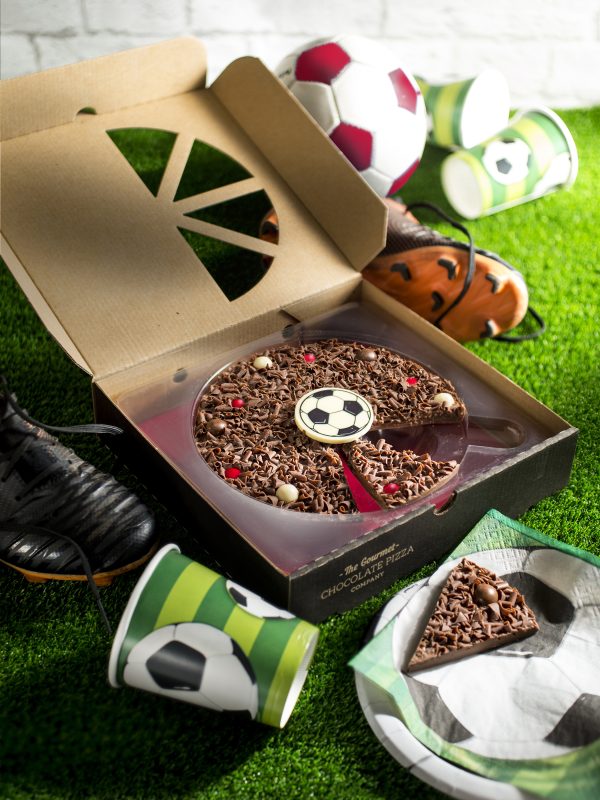 Football chocolate pizza in open box