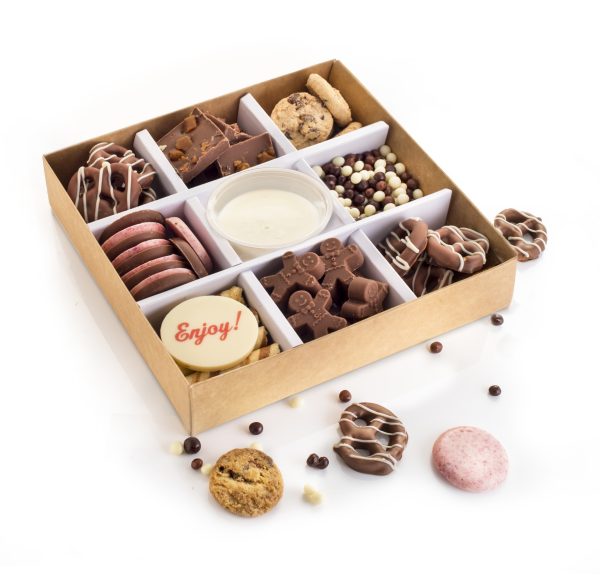 Chocolate grazing box with dipping pieces sprinkled round.